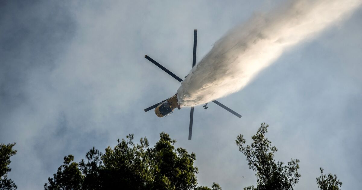 Two helicopters smash into each other while fighting wildfires in terrifying mid-air collision