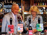 King Charles says it's 'a good day to drown a few sorrows' as he gets behind bar