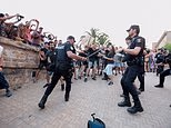 Around 25,000 demonstrators marched against mass tourism on the Mediterranean island, with some leaping over barriers