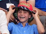 Grinning Prince Louis dons bucket hat as he watches Commonwealth Games alongside family