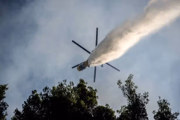 Two helicopters crash in Greece fighting wildfires as search and rescue launched