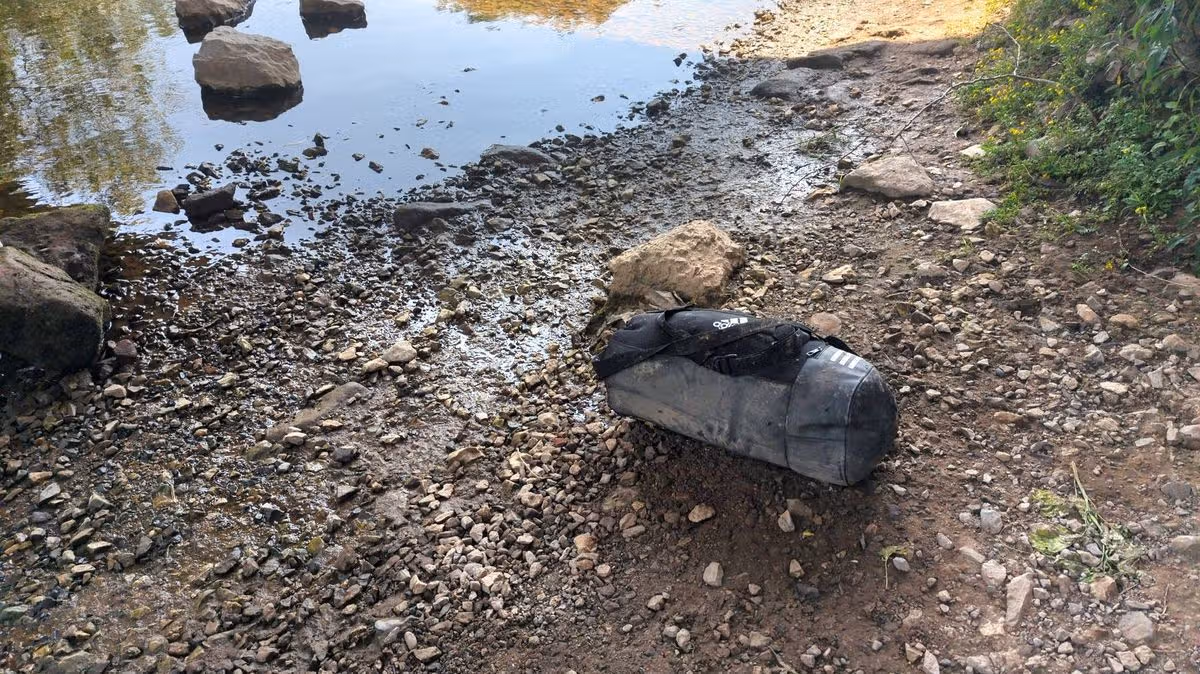 Appalling discovery inside Adidas bag weighted down in Welsh river