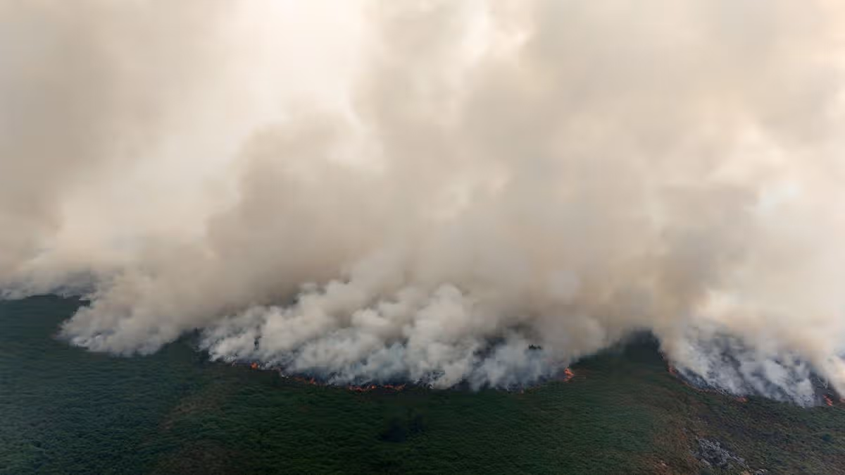 Firefighters still battling wildfire and issues warning to two communities