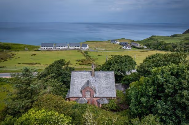 Trees and shrubbery are gradually overtaking the property in one of Wales' most beautiful spots