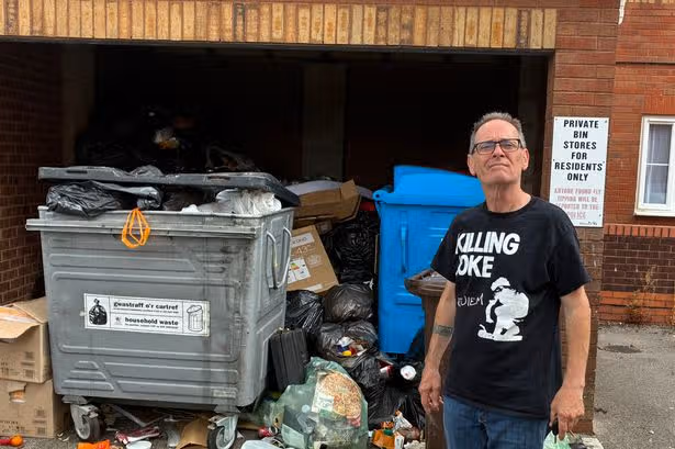 Stinking pile of waste attracting rats and swarms of flies growing outside Cardiff flats