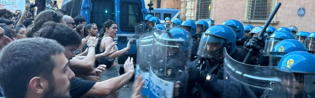 Dead handcuffed, launch paper bomb by protesters and police office in Bologna