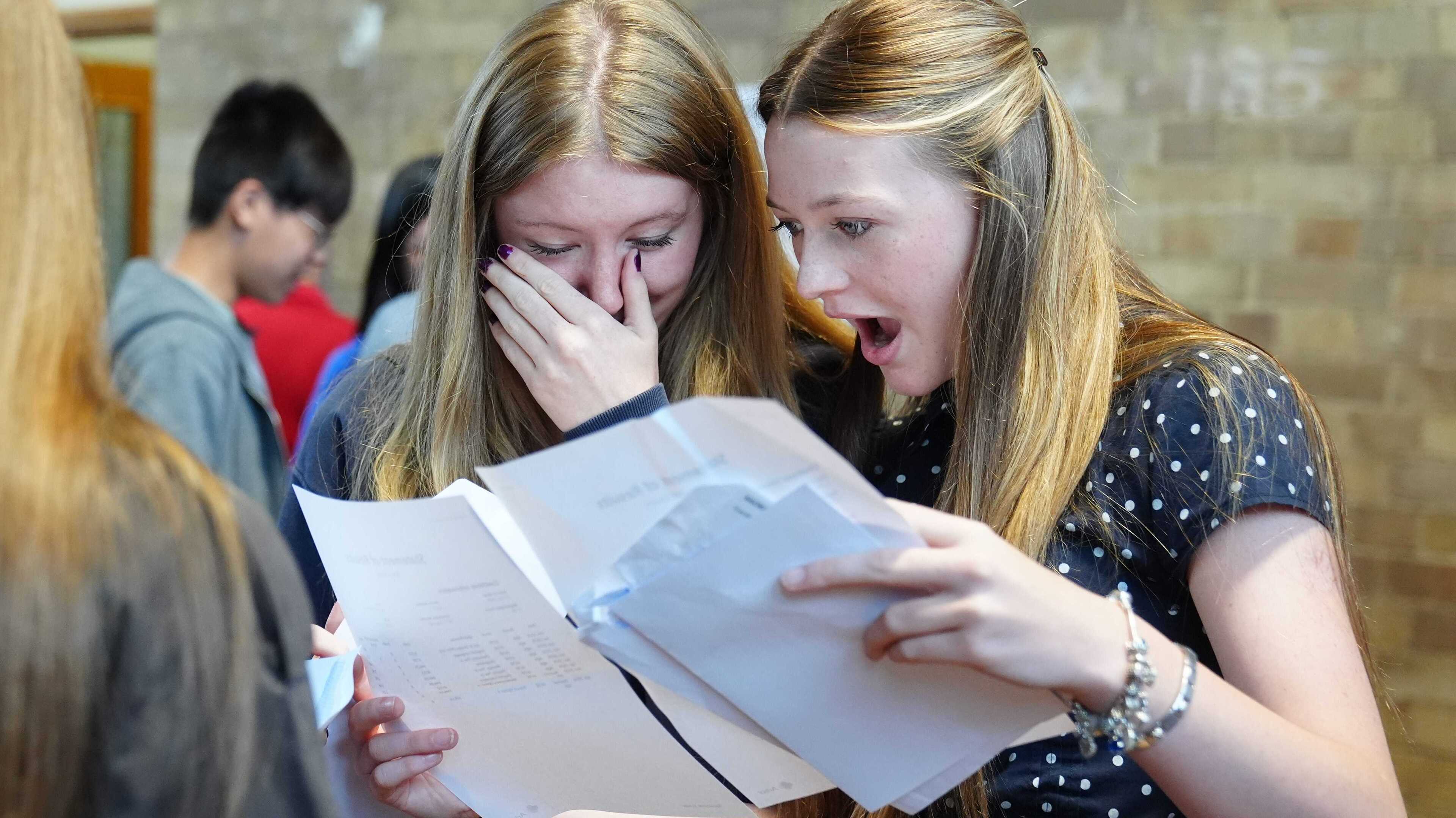 Top GCSE grades rise but key pass rate returns to pre-pandemic levels