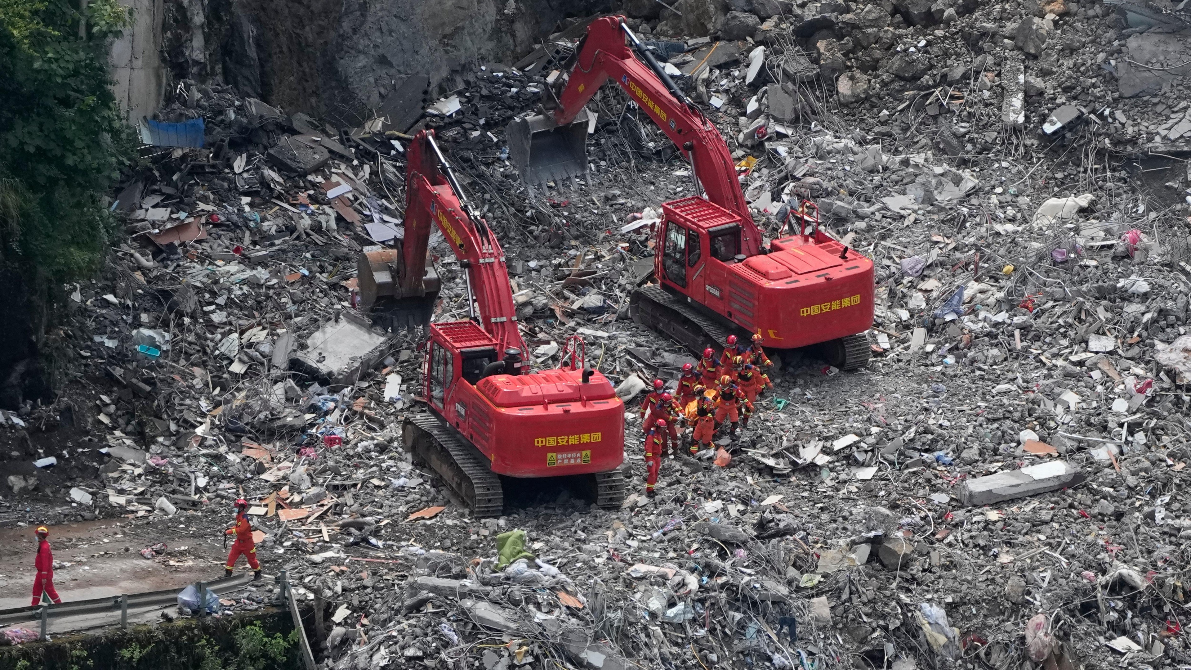 Rescuers in China search rubble for survivors of landslide that killed eight