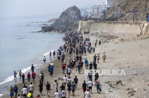 In late July 2026, migrants crossed fences and swam shallow waters into the Spanish exclave, escalating tensions