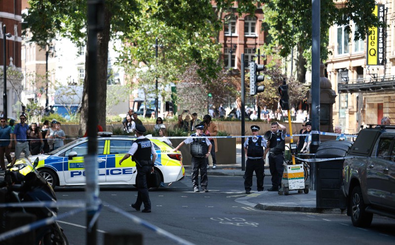 Four men stabbed in London, woman arrested