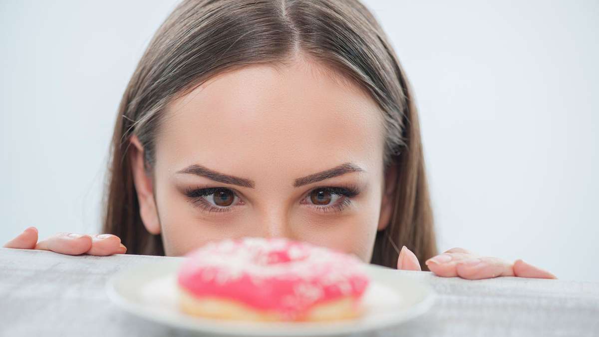 The guide suggests that combining sugar with fat makes it harder to resist, so including fats can aid in the process