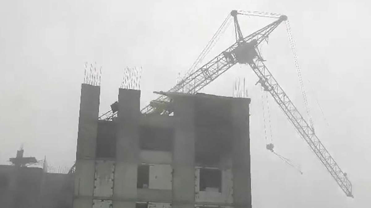 Photographs show dangerous accident: Violent winds throw construction crane with crane operator