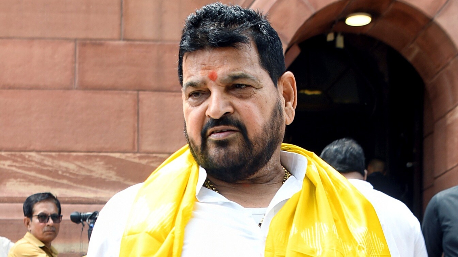 The court also discharged him on allegations from one of the six women wrestlers who had filed the case