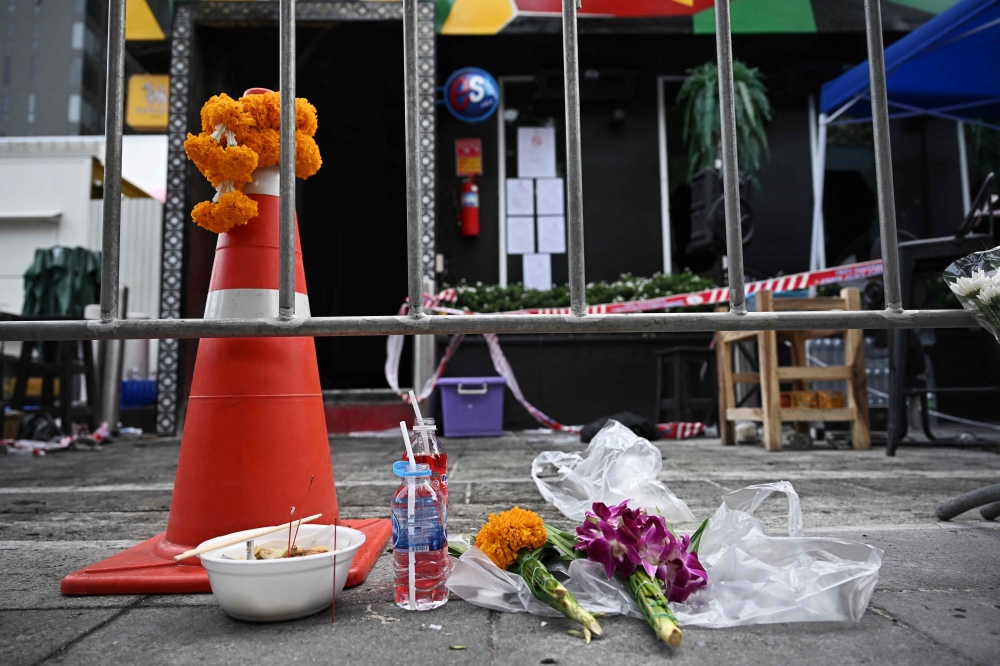 Woman dies week after Bangkok bar fire, raising toll to 34