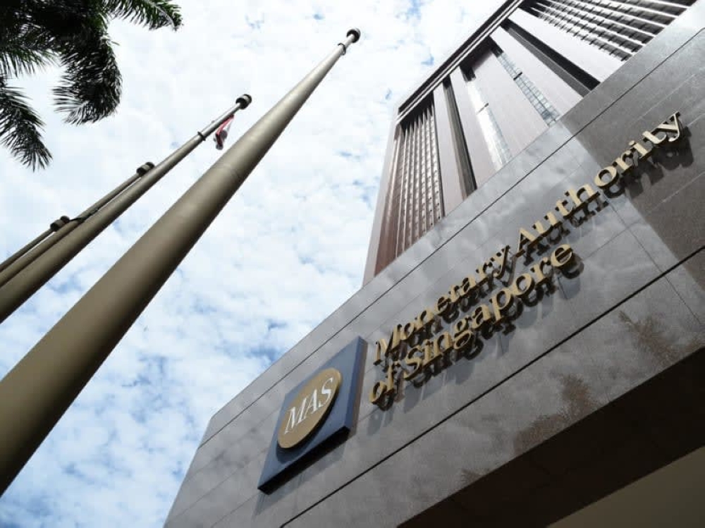 Singapore central bank surprises with second straight policy tightening