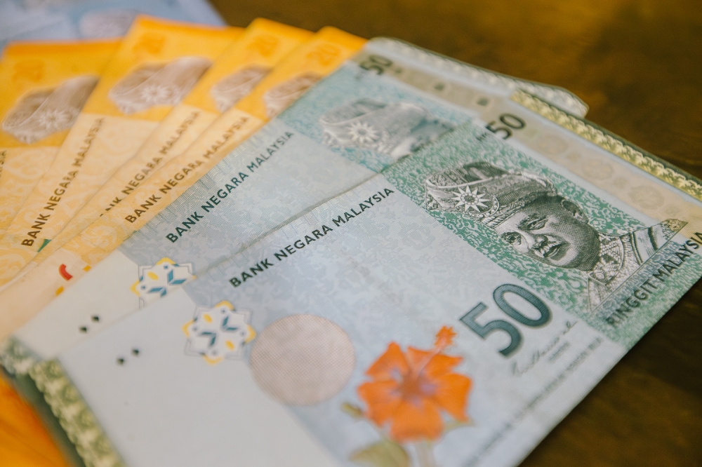 Bank Muamalat chief economist says cautious market may keep ringgit at RM4.07-RM4.09, with US PMI and West Asia tensions in focus